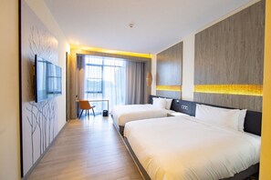 A hotel room with two beds, a TV, a desk, and a window with curtains. - Ciela, Lusaka, a Tribute Portfolio Resort and Spa (Lusaka)
