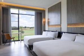 A hotel room with two beds, a desk, and a view of a golf course. - Ciela, Lusaka, a Tribute Portfolio Resort and Spa (Lusaka)
