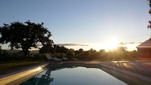 A clear swimming pool with lounge chairs and a tree in the background. - Quinta da Teimosa by Portugal Active (Viana do Castelo)