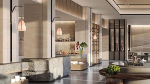 Un intérieur moderne comprenant un espace cuisine, un coin salon et un comptoir d’accueil.