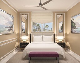 Un dormitorio con cama, ventilador de techo, dos mesitas de noche y una ventana con vistas a palmeras y montañas.