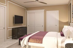 Un dormitorio con cama, televisión, ventilador de techo y armario.