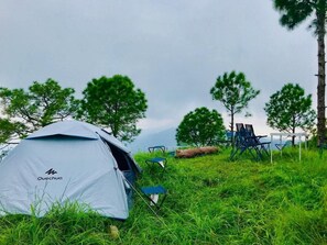 A Quechua tent set up on a grassy field with trees in the background. - Fortune Select Forest Hill Kasauli (Solan)