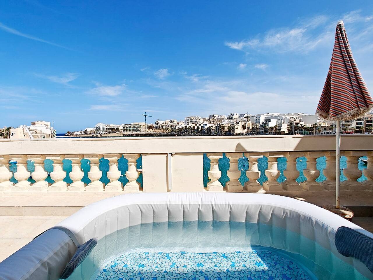A rooftop pool with a clear view of the cityscape.