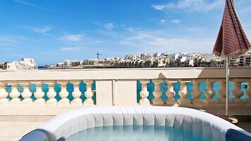 A rooftop pool with a clear view of the cityscape.