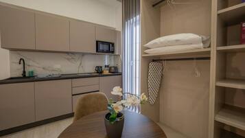 Microwave, stovetop, toaster, cookware/dishes/utensils