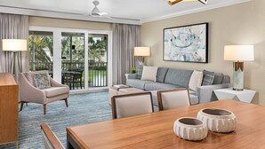 A modern hotel room with a dining area, a sofa set, and a large window with a view of the outdoors. - In the heart of Vail Valley, Sheraton Mountain Vista is the perfect vacation (Avon)