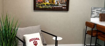 A stylish 4-bedroom Bloomington getaway with a game room, fenced yard, covered patio, EV charger, and space for 8—perfect for IU weekends, weddings, golf trips, and group stays.