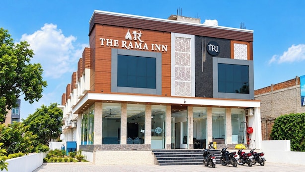 A hotel named 'The Rama Inn' with a modern facade, large windows, and a visible entrance. - The Rama Inn (Faizabad)