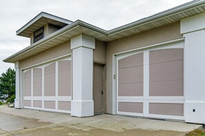 A two-car garage with a beige exterior and white trim.
