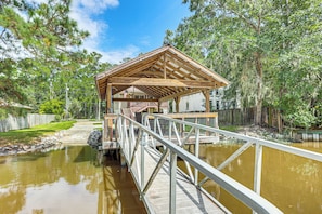 A wooden gazebo with a metal railing over a pond, surrounded by trees. - Fish & Hunt! Waterfront Home w/ Dock in Midway (Midway)