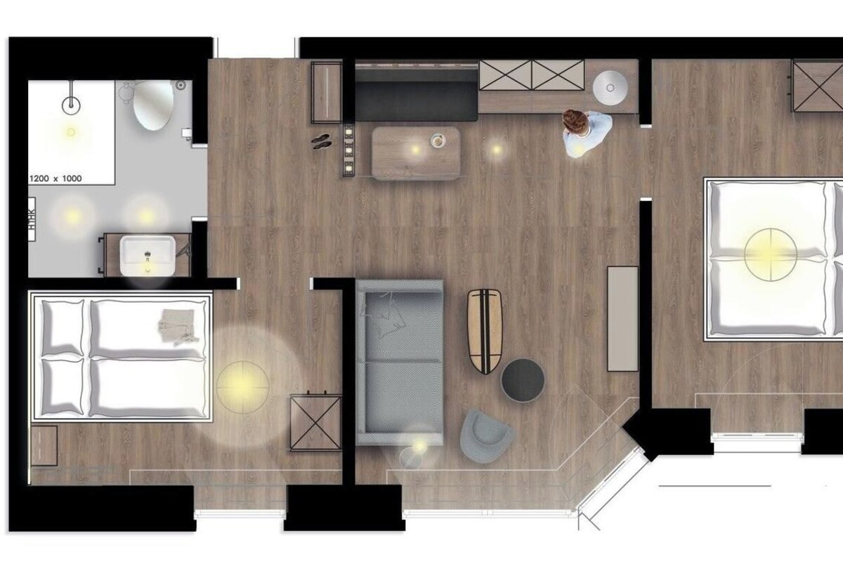 A hotel room layout with a bed, seating area, kitchenette, and bathroom.