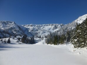 A snowy mountain landscape with a clear sky.