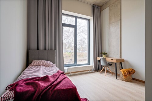 Uniflow Apartments by Rixwell