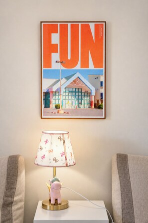 A framed poster with the word 'FUN' and a building illustration. - Camberwell 3BR, 3 Bathrooms | Courtyard & Parking (Camberwell)