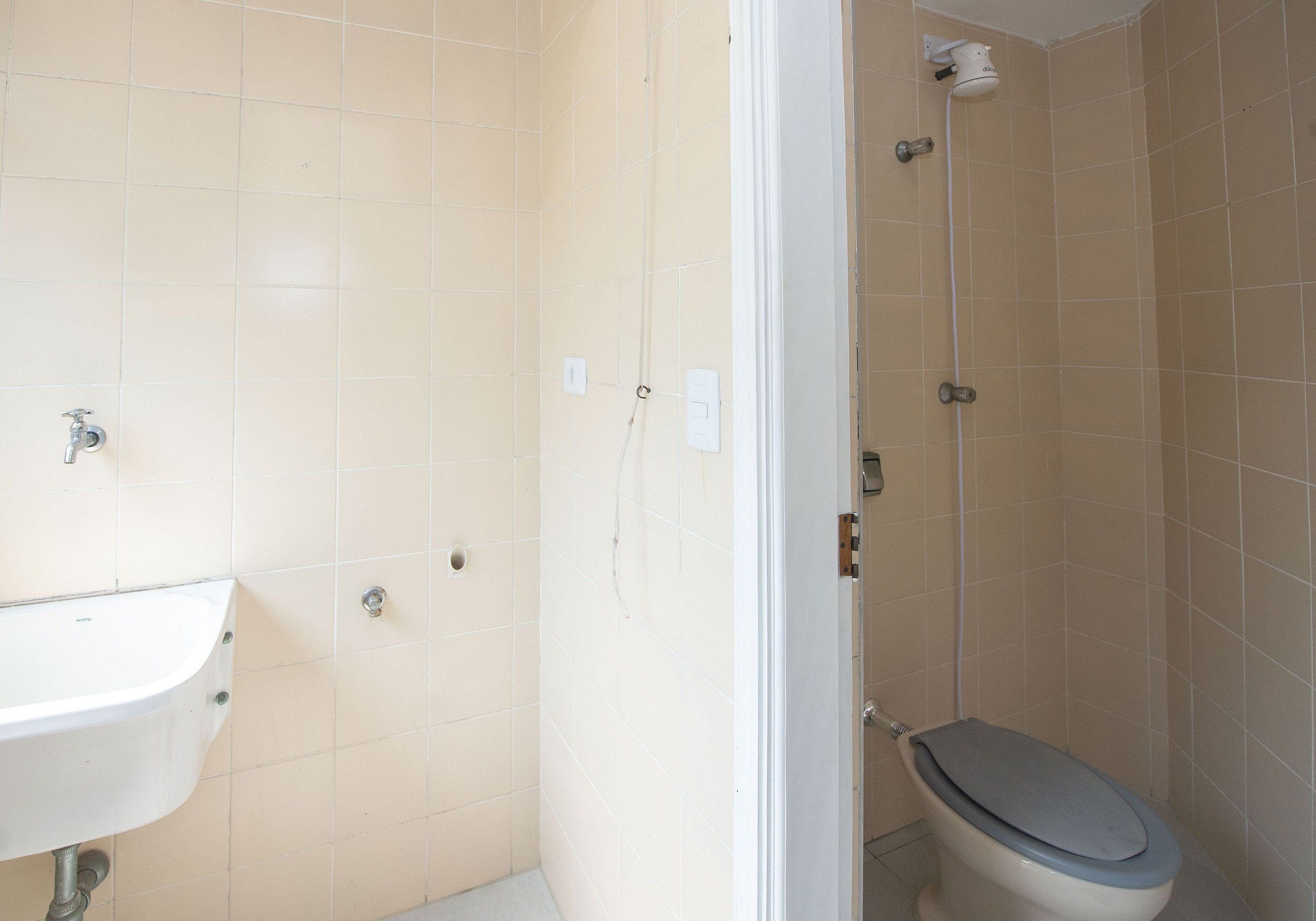 A bathroom with a sink, toilet, and shower.