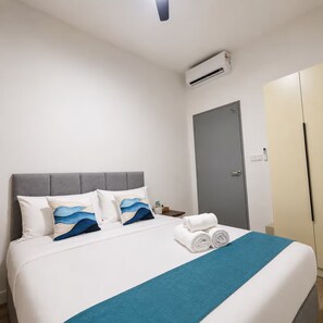 A hotel room with a bed, an air conditioning unit, a door, and a wardrobe. - Skyline A43A-07 Heart of the city, new (Kuala Lumpur)