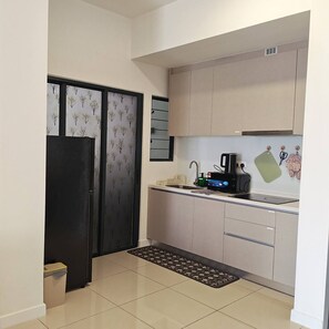 A compact kitchen with a refrigerator, a coffee maker, and a sink. - Skyline A43A-07 Heart of the city, new (Kuala Lumpur)