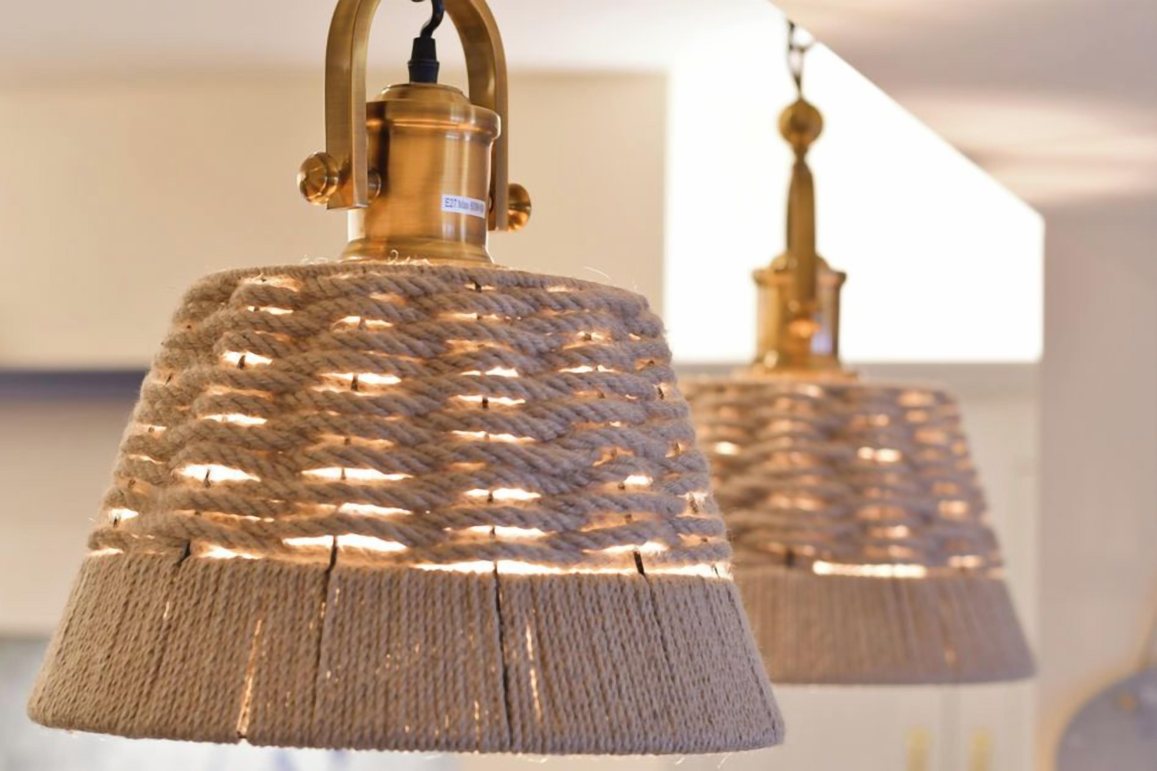 A close-up of a rope-wrapped pendant light fixture.