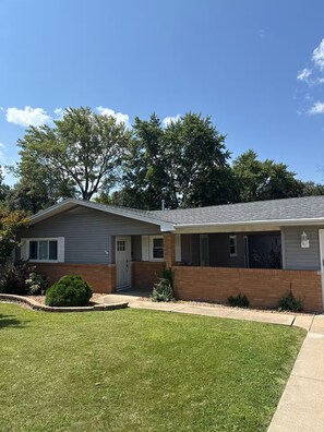 A two-story residential building with a brick facade and a flat roof. - Welcome to Streator Hilltop - 3 bedroom home fully renovated and beautiful! (Streator)