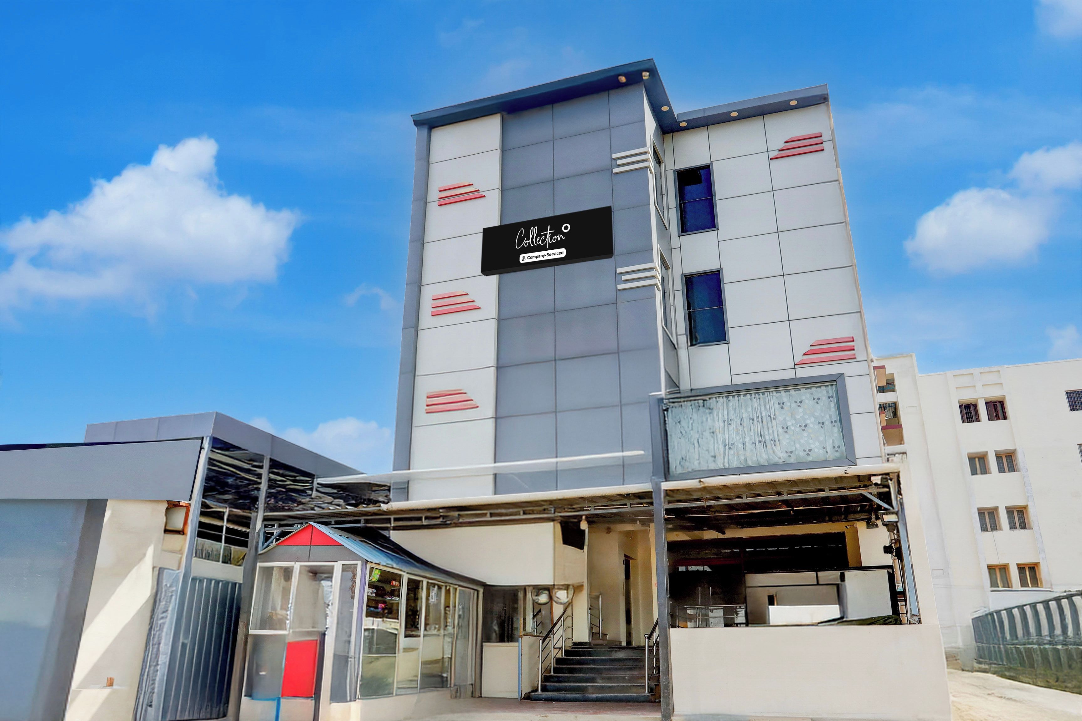 A modern building with a sign indicating it is a company-serviced location.