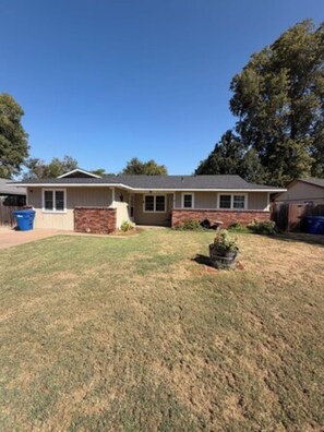 A single-story house with a front yard and a garage.