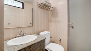A bathroom with a sink, toilet, and a shower area. - Super Collection O Vaishno Devi Temple (Katra)