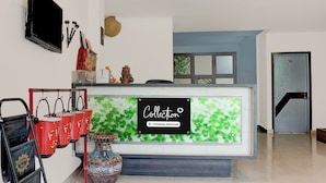A reception desk with a sign that reads 'Collection' and 'Company-Serviced.' - Super Collection O Vaishno Devi Temple (Katra)