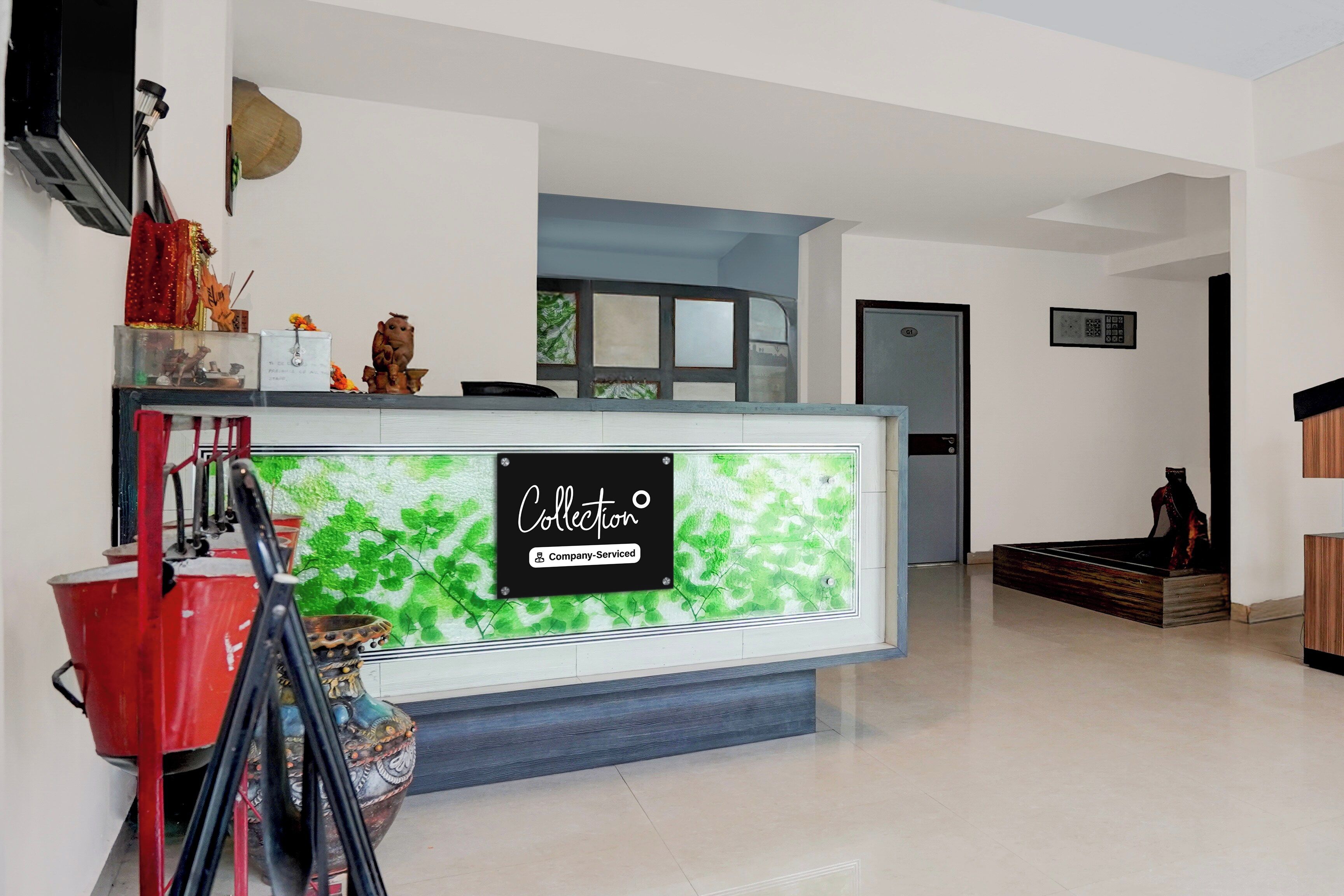 A reception area with a sign reading 'Collection Company-Serviced.'