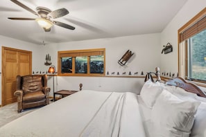 A bedroom with a bed, a chair, a desk, a window, and a ceiling fan. - Keystone Ranch Escape | Hot Tub + Grill + Deck (Dillon)