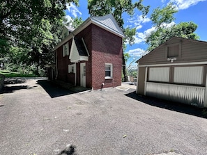 A two-story brick building with a garage and a covered area. - Quiet & near downtown Carnegie (Carnegie)