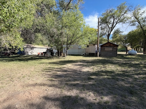 Rustic 3-bedroom mobile home with game room on large lot in Maybell,