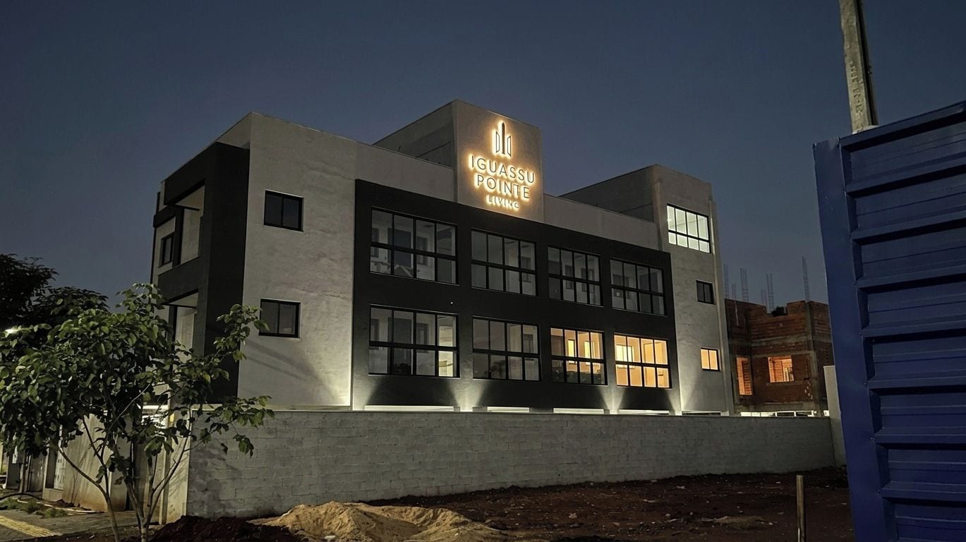 A modern building with a sign that reads 'IGUASSU POINTE LIVING'.