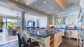A spacious kitchen with a large island, stainless steel appliances, and ample storage. - VILLA AZURE (Blue Mountain)
