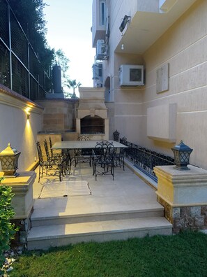 Outdoor dining - Gorgeous 5-bedroom home with pool and garden in 6th of October, Giza district. (Giza Governorate)