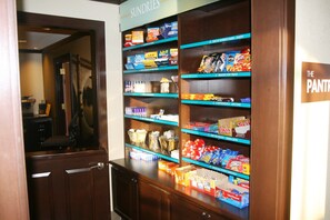 A snack bar with various food items and a sign indicating it's the pantry area.