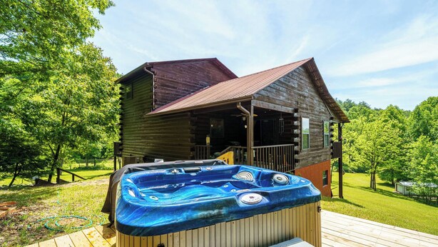 A wooden cabin with a hot tub on a wooden deck. - LeVasseur Cabin  Simple Escape (Murphy)