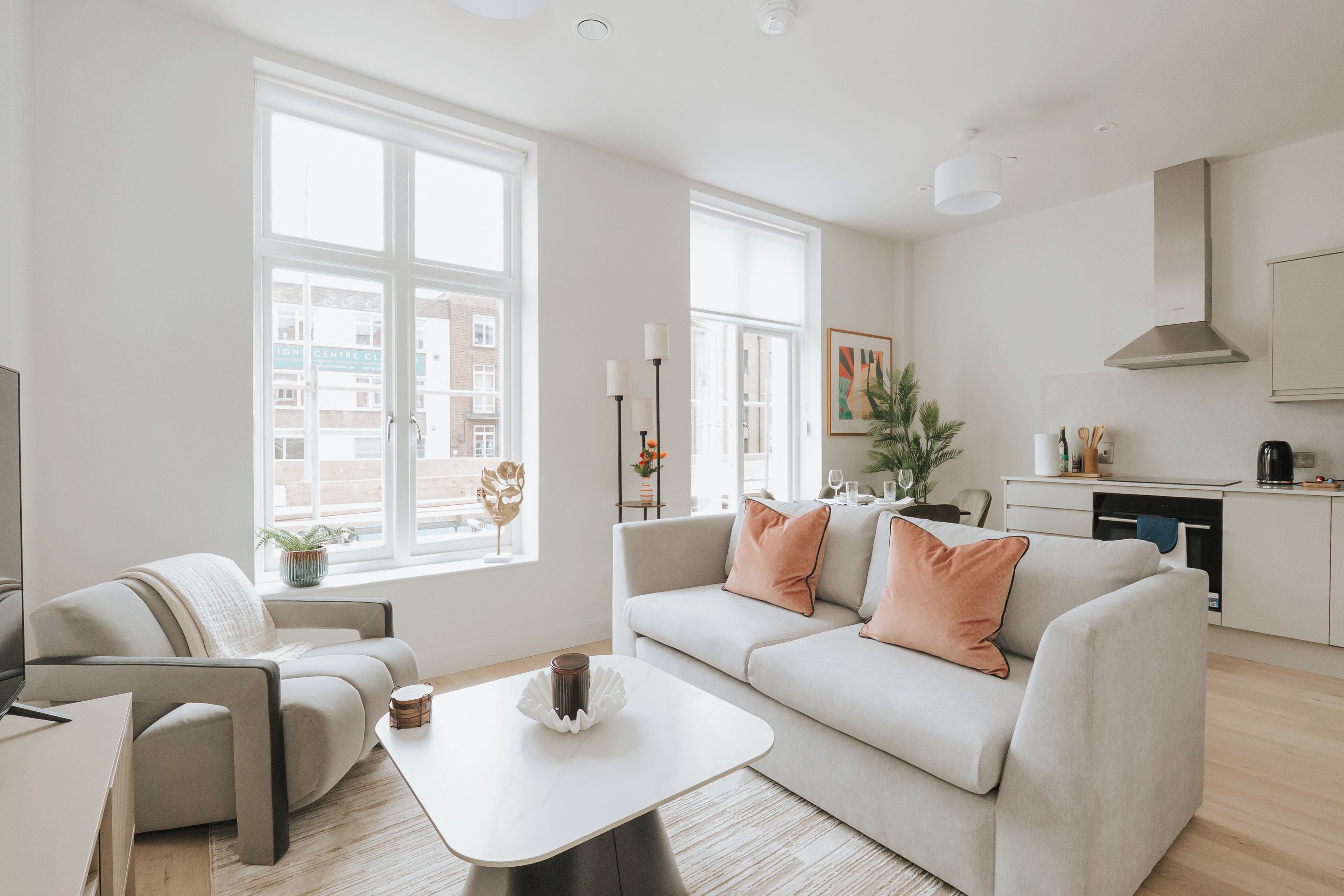 A modern living room with a sofa, coffee table, and a television.