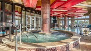 A hot tub area with a tiled floor, metal railings, and a large pillar. - Oceanaire Virginia Beach - 1BR Ocean View Suite, Full Kitchen + Balcony (Virginia Beach)