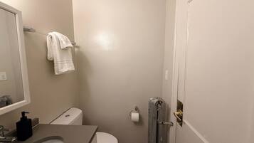 Shower, hair dryer, towels, shampoo