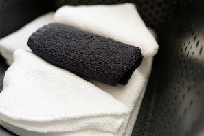 A black and white towel in a basket.