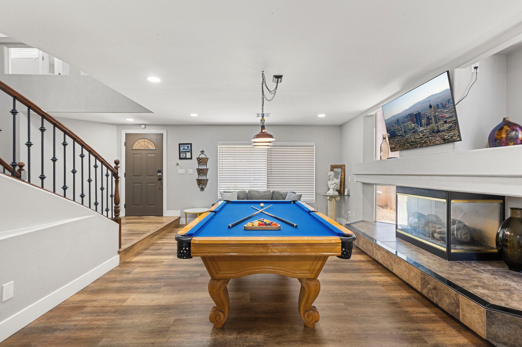 Spacious game room with pool table, air hockey and arcades