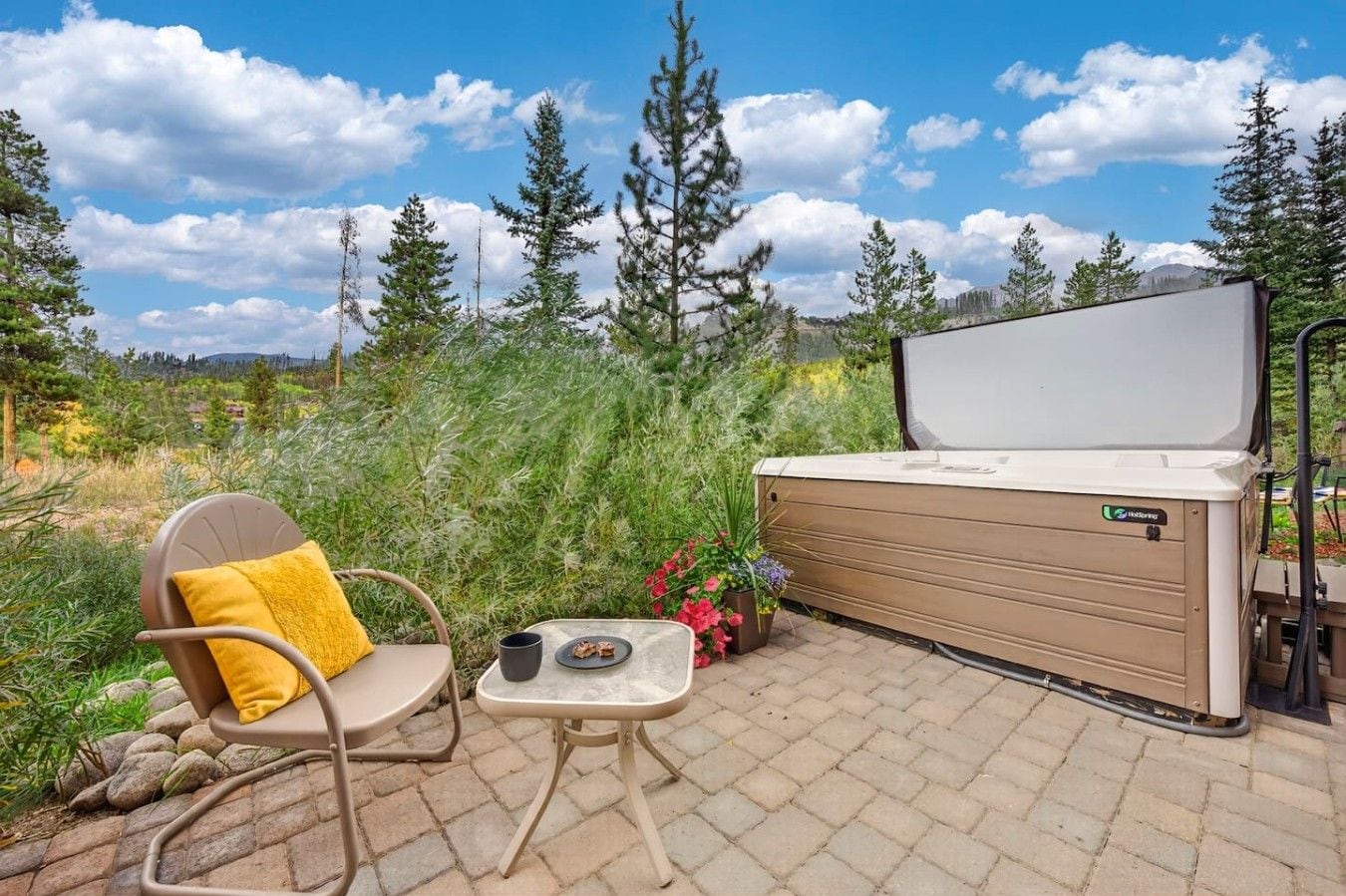 Private hot tub with beautiful mountain views and outdoor seating