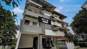 A multi-story hotel with a prominent sign reading 'HOTEL'.