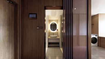 A modern bathroom with a vanity, sink, and mirror.