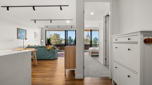 A modern interior with a kitchen, dining area, and bedroom. - State Circle Stay | 10-Min Walk to Parliament (Forrest)