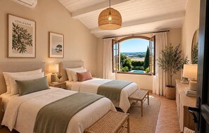 A hotel room with two beds, a large window with a view, a hanging light fixture, and a small table. - Villa Avana avec Pisicne (Six-Fours-Les-Plages)