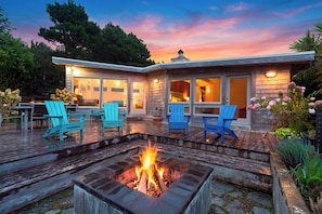 A modern house with a deck, outdoor seating, and a fire pit. - Ocean-View Deck + Fire Pit + BBQ | Short Walk to the Beach | The Grey Piper (Arch Cape)