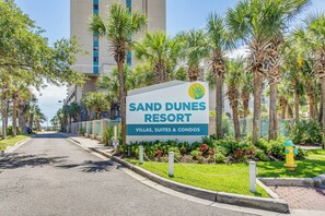A sign for Sand Dunes Resort advertising villas, suites, and condos. - Sand Dunes Resort Condo w/ Water Views! (Myrtle Beach)