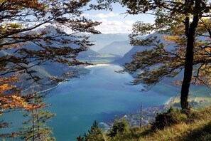 A mountainous landscape with a lake and a town in the valley.